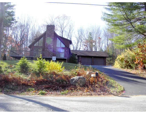 88 Beaver Road Ware, MA 01082 - Photo 1 of 4 a view of a house with a small yard and plants