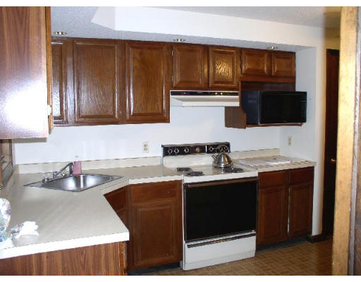 88 Beaver Road Ware, MA 01082 - Photo 4 of 4 a kitchen with stainless steel appliances granite countertop a sink stove and microwave