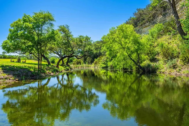a view of a lake with a outdoor seating