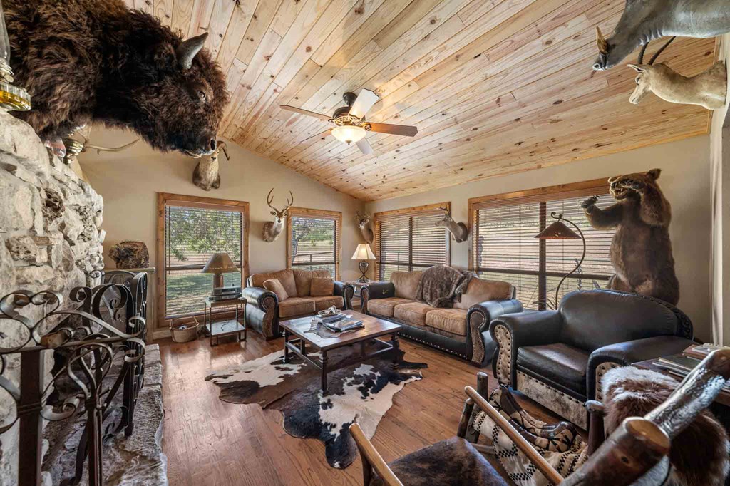 161 Flach Rnch Road Comfort, TX 78013 - Photo 31 of 69 a living room with furniture and wooden floor