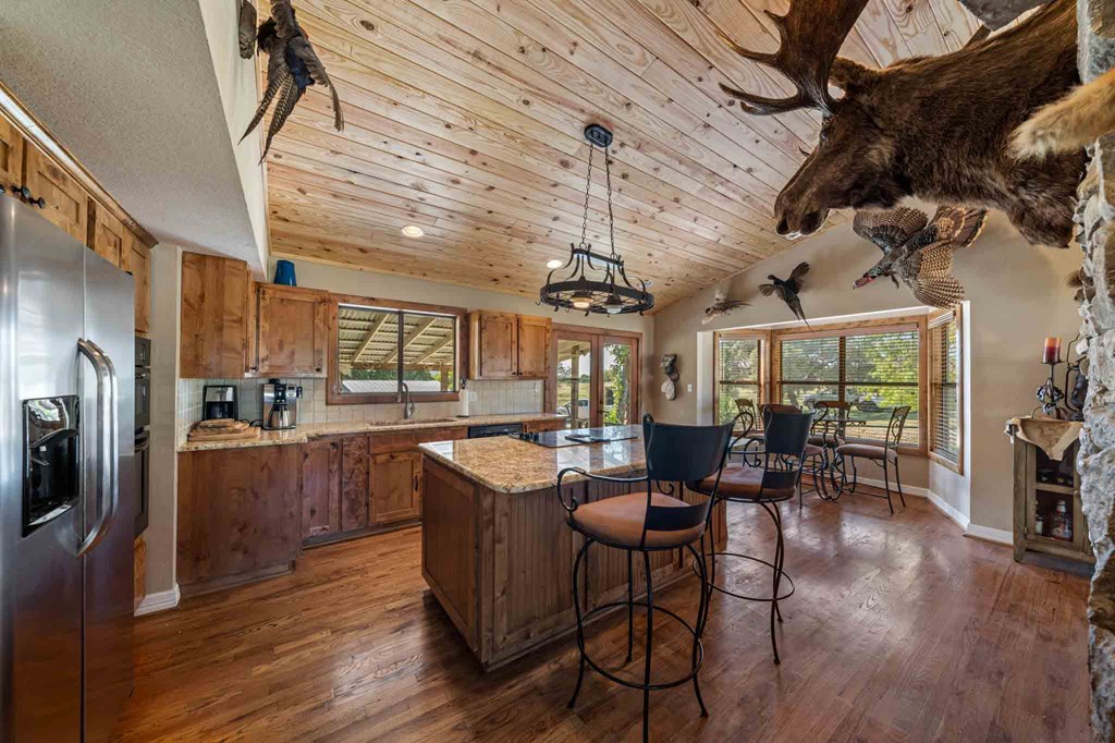 161 Flach Rnch Road Comfort, TX 78013 - Photo 35 of 69 a very nice looking room with kitchen view and furniture