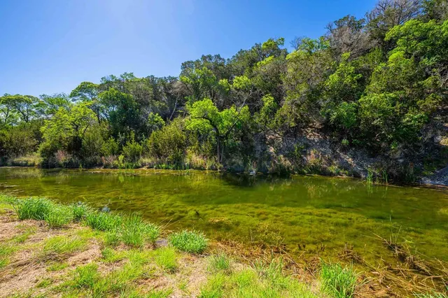 a view of a lake with a big yard