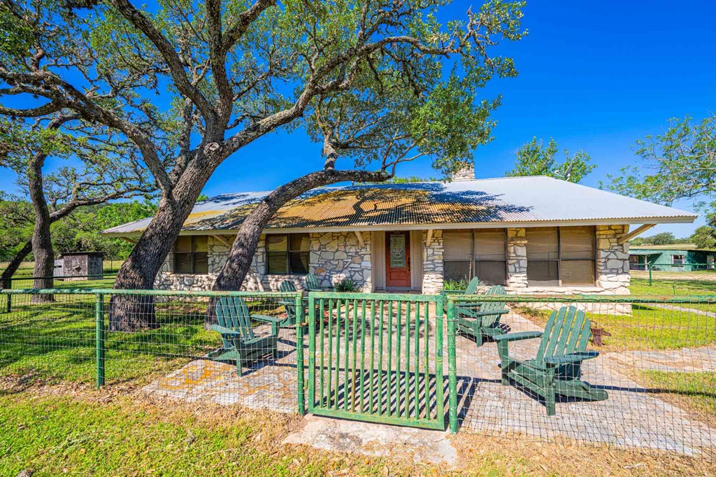 161 Flach Rnch Road Comfort, TX 78013 - Photo 45 of 69 a front view of a house with a garden