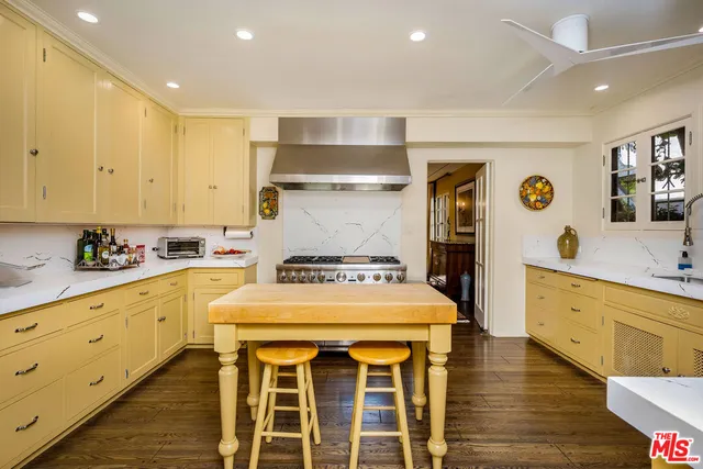 a spacious bedroom with a bed and a couch