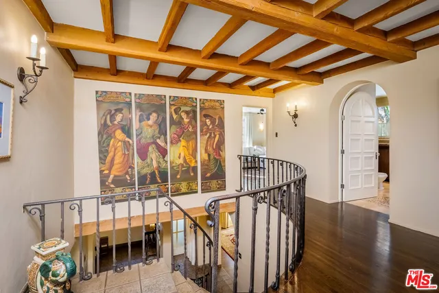 a utility room with dryer washer and racks