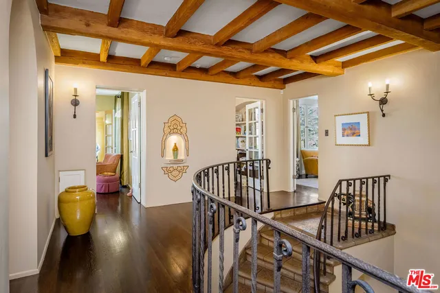 a view of a chair and table on the garden