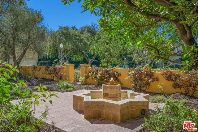 a living room with a large window and a table