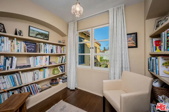 a front view of a house with a yard and tree s