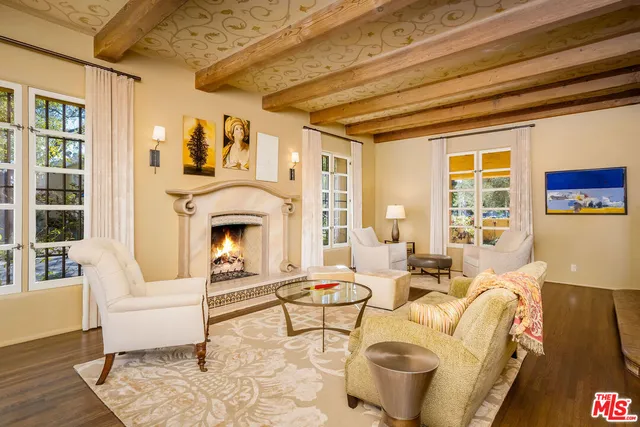 a kitchen with stainless steel appliances granite countertop a stove and white cabinets