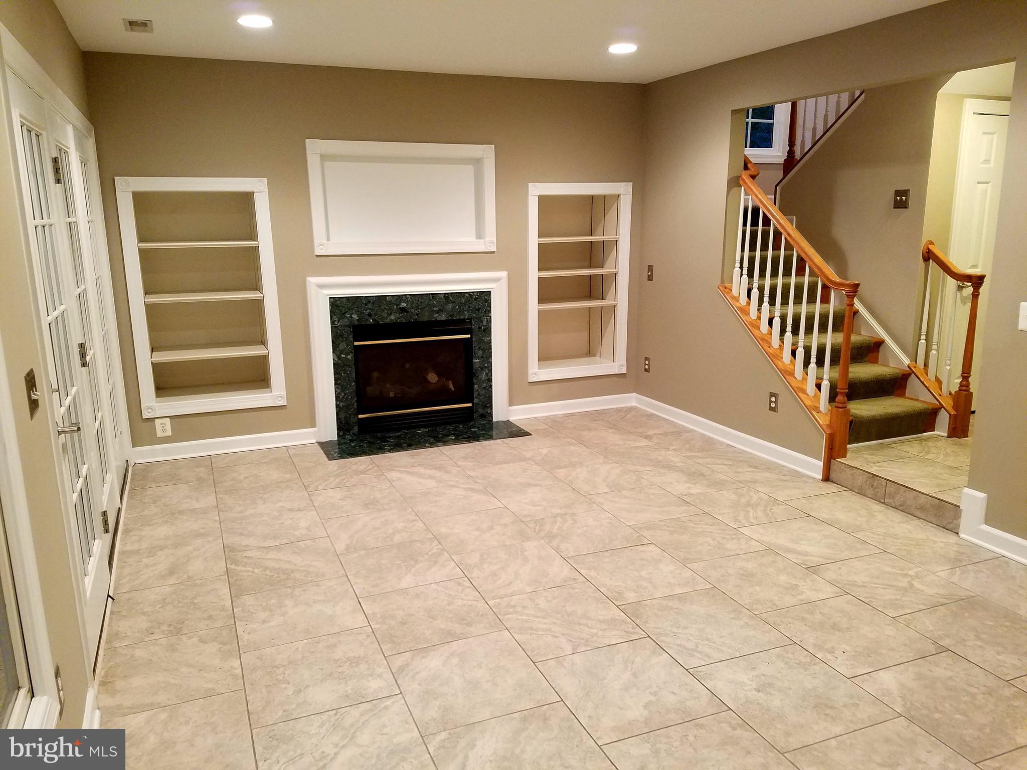 334 Helmuth Lane Alexandria, VA 22304 - Photo 5 of 7 Travertine tile on lower level