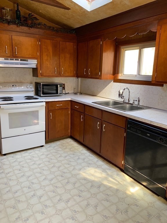 29 May Street Spencer, MA 01562 - Photo 14 of 27 a kitchen with a sink cabinets and window