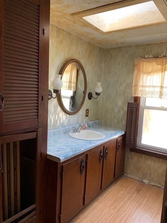 29 May Street Spencer, MA 01562 - Photo 17 of 27 a bathroom with a sink and a mirror