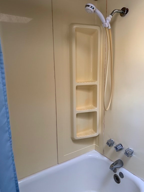 29 May Street Spencer, MA 01562 - Photo 19 of 27 a bathroom with a tub and shower