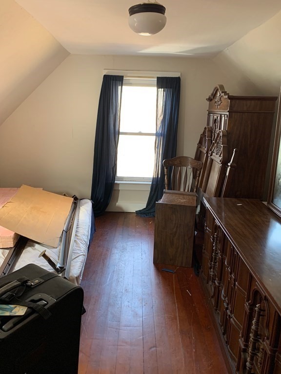 29 May Street Spencer, MA 01562 - Photo 21 of 27 a view of a hallway with wooden floor and furniture