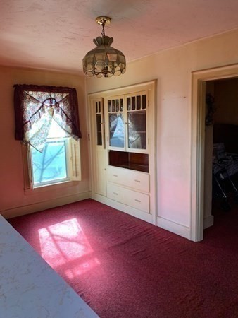 29 May Street Spencer, MA 01562 - Photo 7 of 27 en empty room with windows and entrance