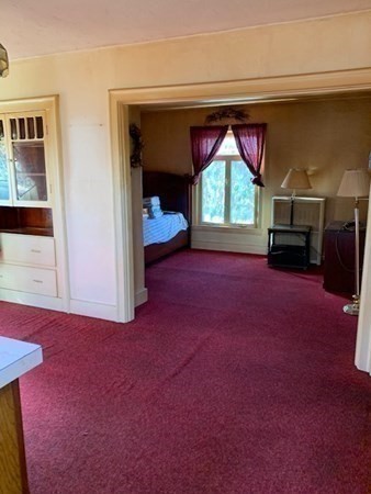 29 May Street Spencer, MA 01562 - Photo 8 of 27 a view of empty room with a fireplace