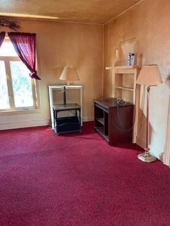 29 May Street Spencer, MA 01562 - Photo 9 of 27 a living room with furniture and a window