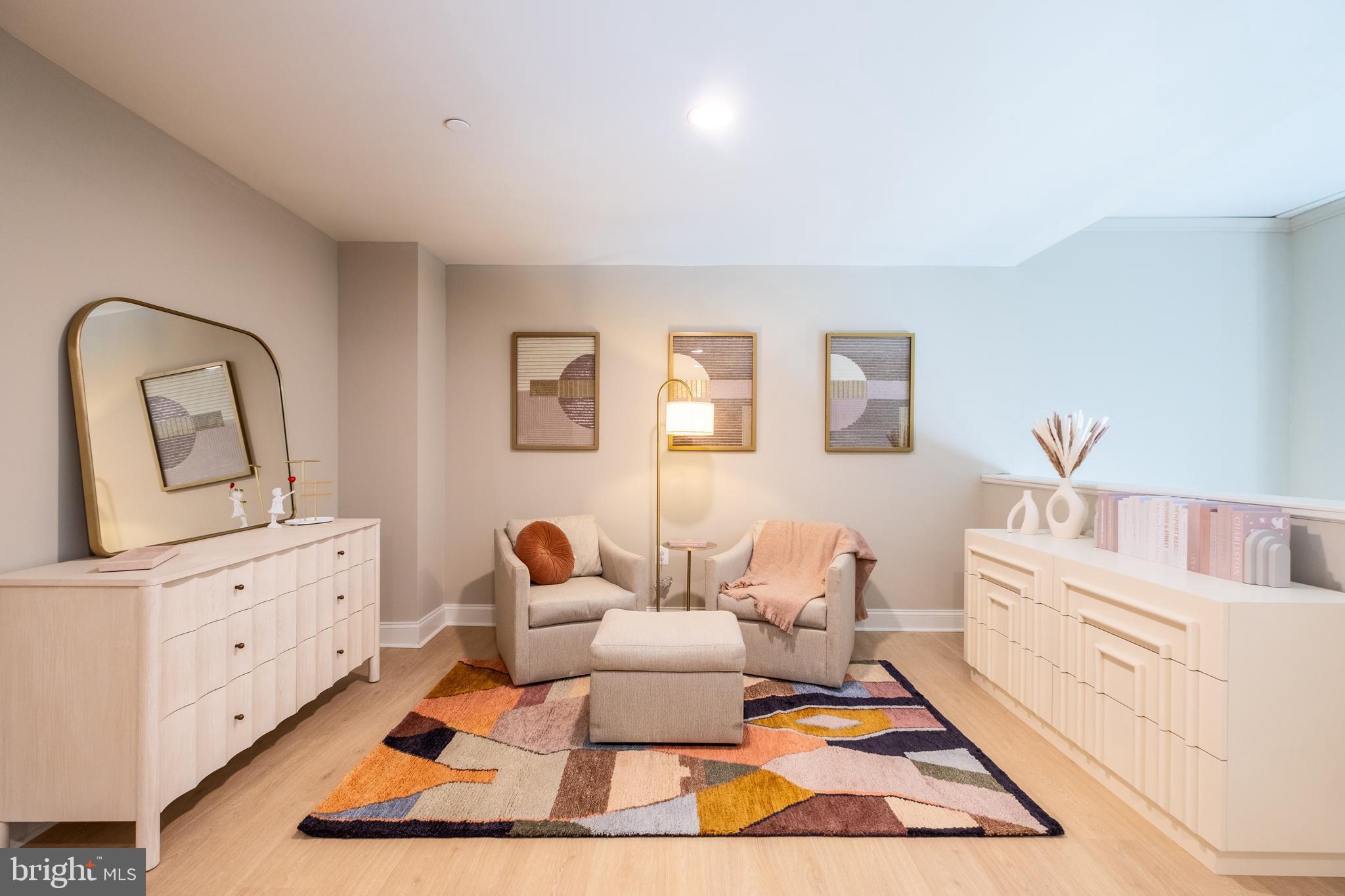 2301-61 John F Kennedy Boulevard, Unit 210 Philadelphia, PA 19103 - Photo 8 of 36 a living room with furniture a rug and a lamp