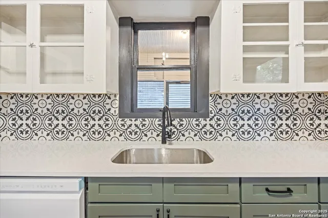 a bathroom with a sink and a window