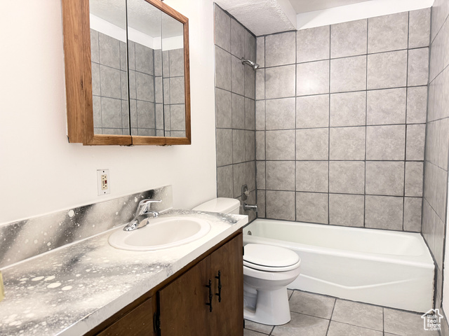420 North 200 West Logan, UT 84321 - Photo 5 of 13 Bathroom featuring vanity, shower combination, and light tile patterned floors