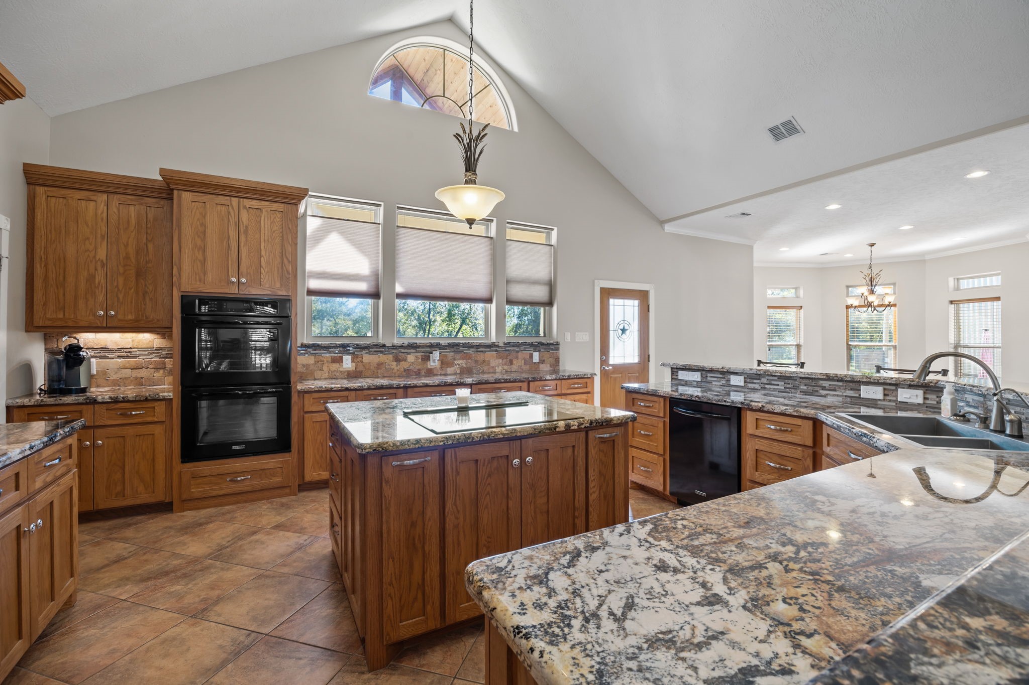 3998 County Road 612 Angleton, TX 77515 - Photo 15 of 47 a kitchen with stainless steel appliances granite countertop a sink stove and refrigerator