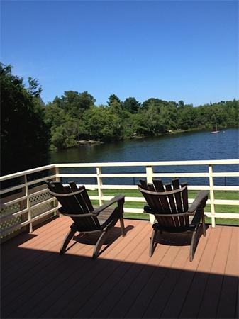 a view of a lake with outdoor seating