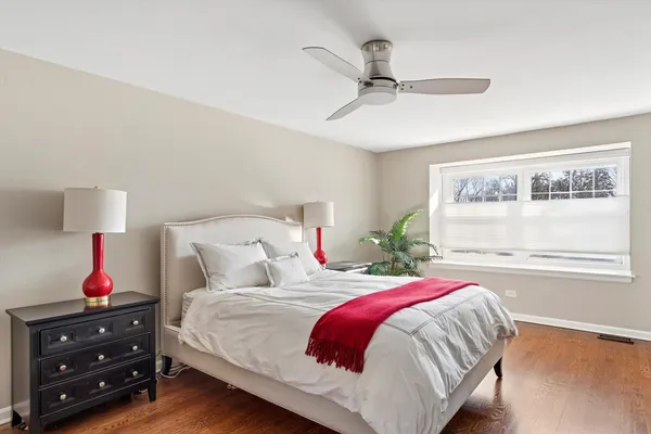 a spacious bathroom with a granite countertop sink toilet and shower