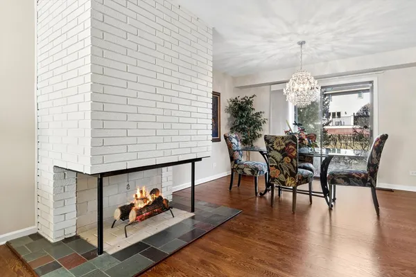 a view of a livingroom with furniture and hardwood floor