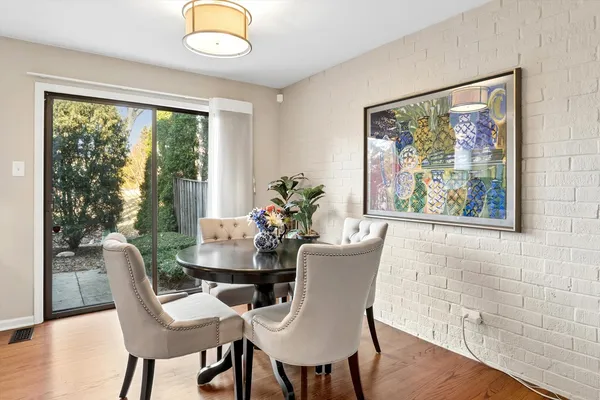 a view of a dining room with furniture window and wooden floor