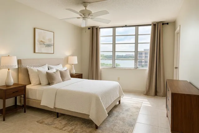 a bedroom with a large bed and a window