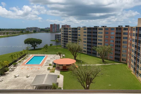 a view of a swimming pool of a building with outdoor space