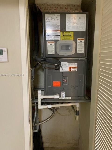 1750 Northeast 191st Street, Unit 8163 Miami, FL 33179 - Photo 6 of 7 a room with storage and utility