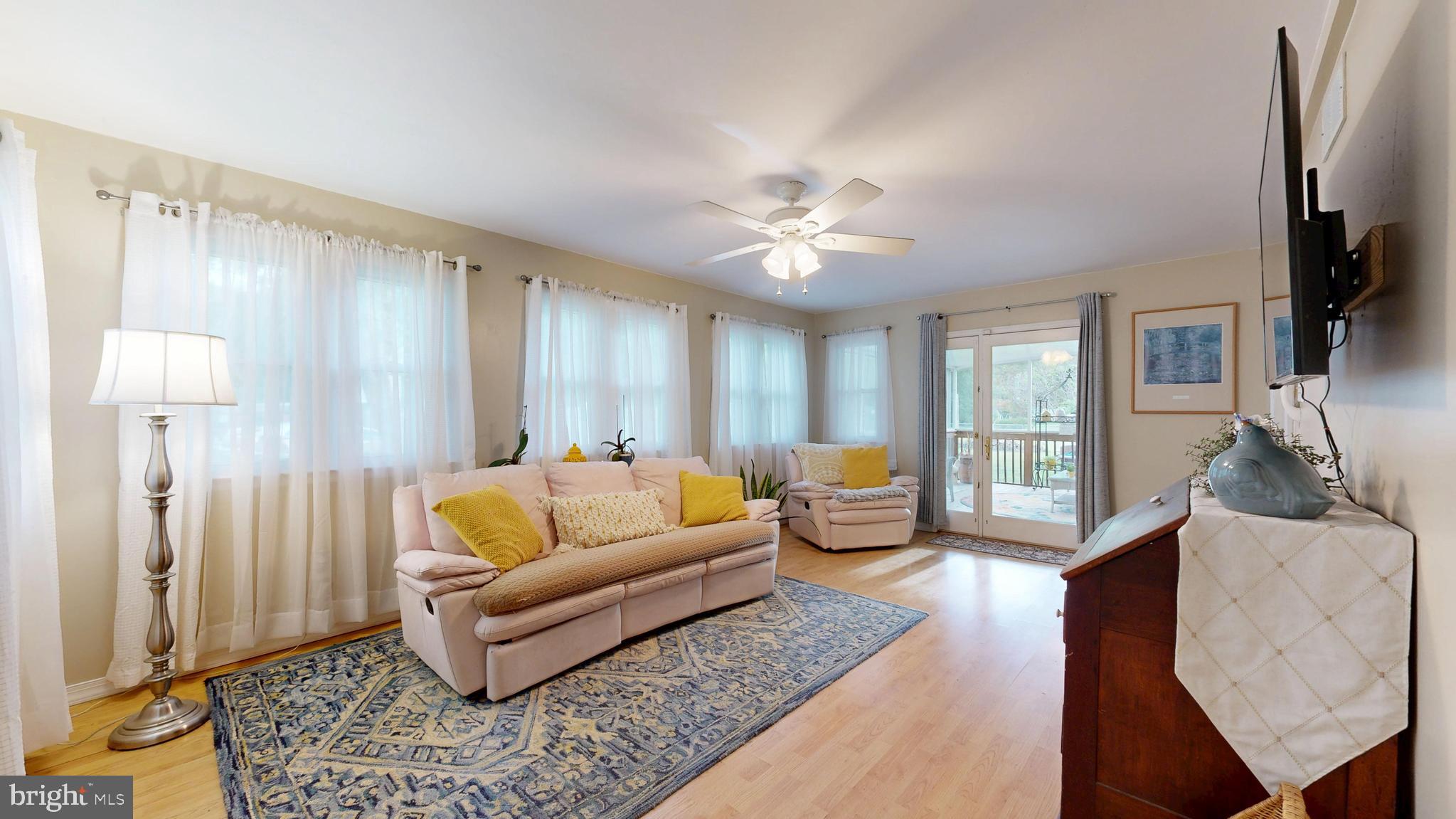 705 Deer Track Lane Dover, DE 19904 - Photo 16 of 29 a living room with furniture fireplace and a flat screen tv