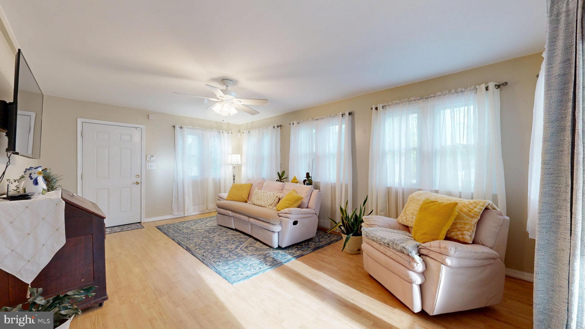 705 Deer Track Lane Dover, DE 19904 - Photo 17 of 29 a living room with furniture and a flat screen tv