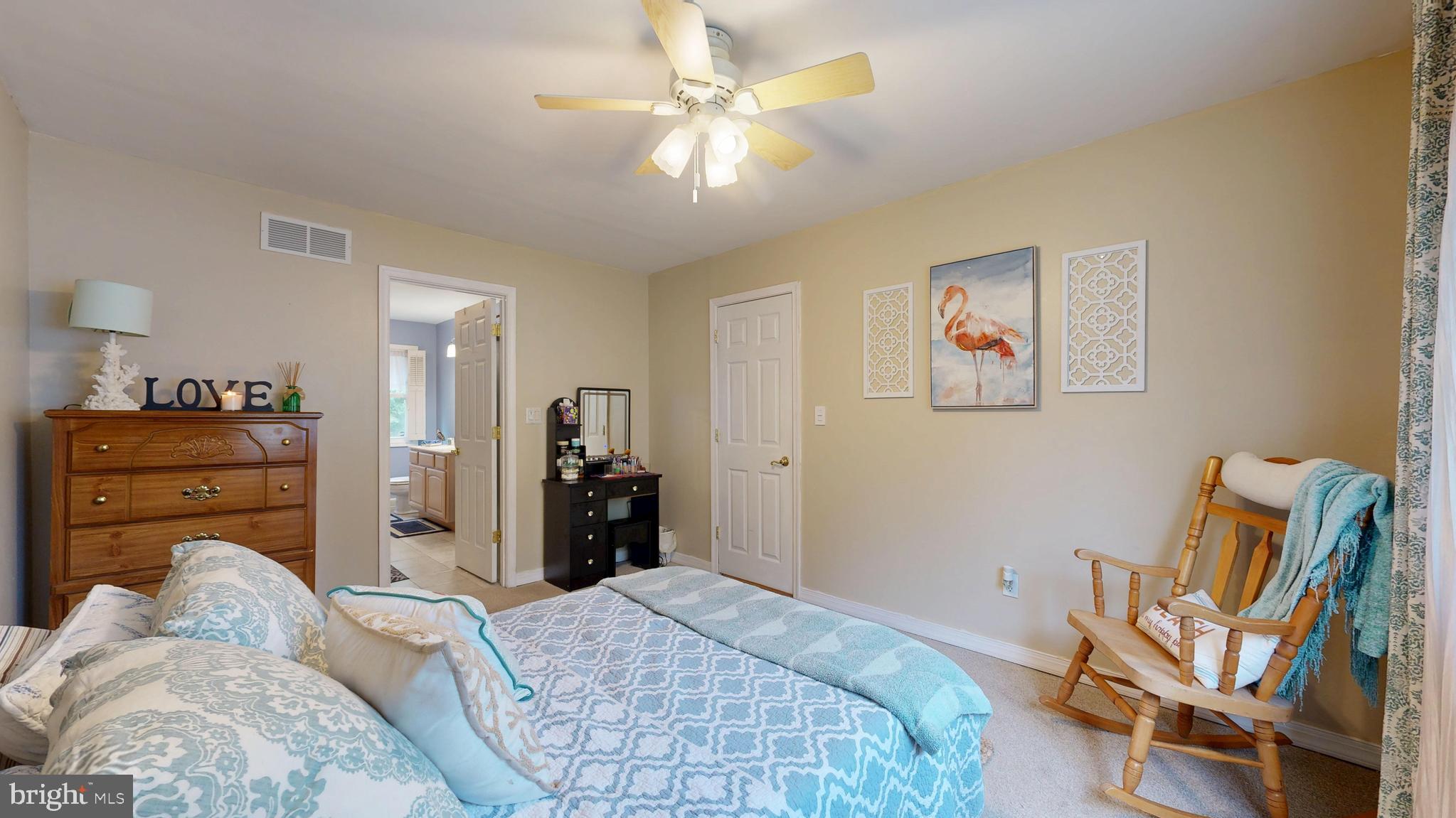 705 Deer Track Lane Dover, DE 19904 - Photo 20 of 29 a bedroom with a bed and furniture