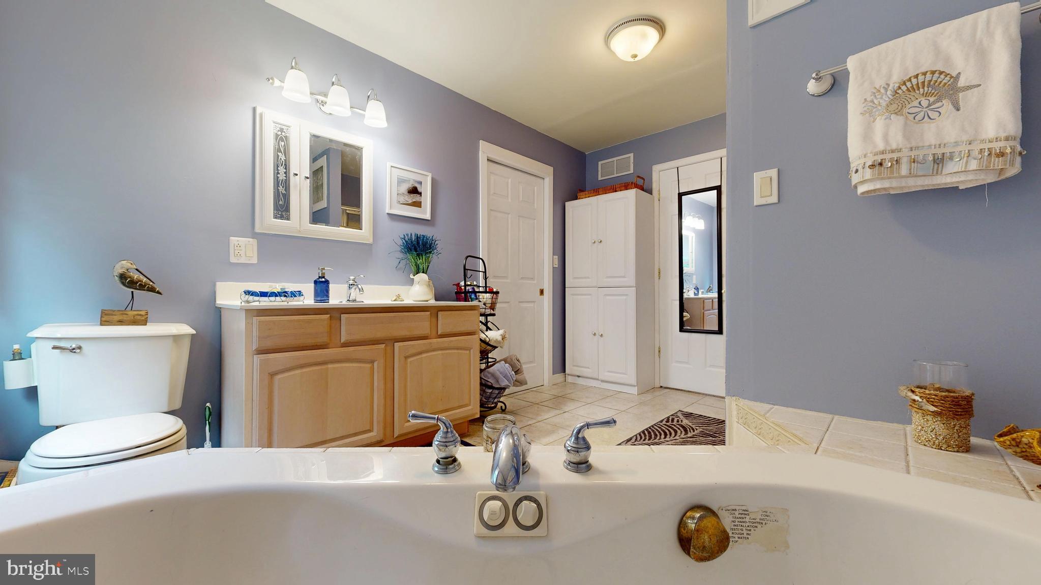 705 Deer Track Lane Dover, DE 19904 - Photo 21 of 29 a bathroom with a sink double vanity and a toilet