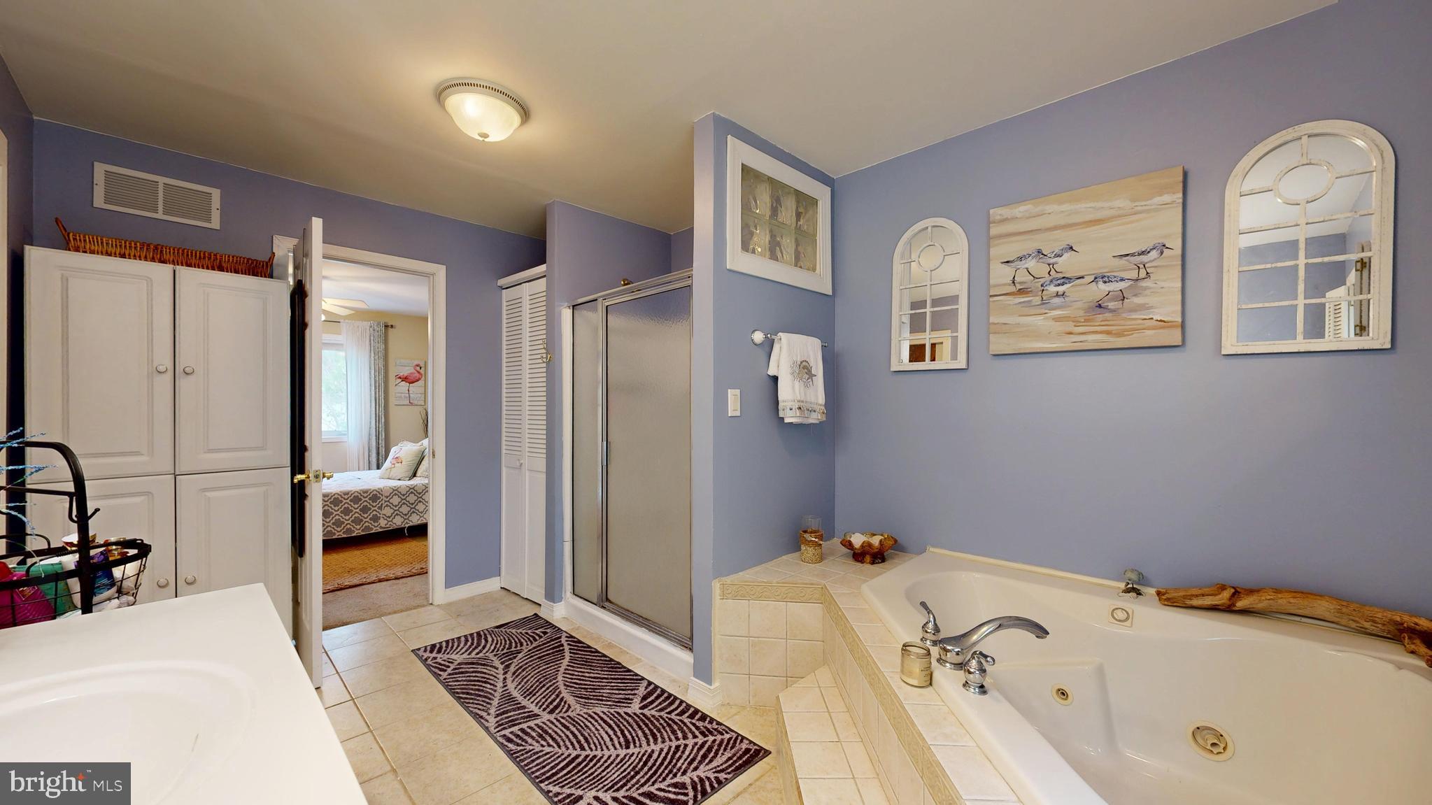 705 Deer Track Lane Dover, DE 19904 - Photo 22 of 29 a bedroom with a bed and a couch