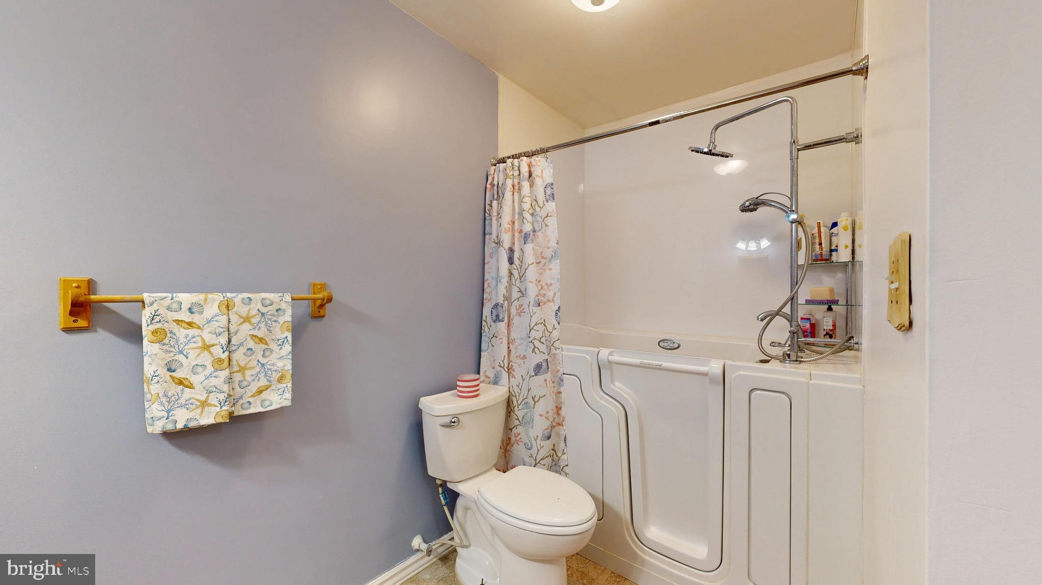 705 Deer Track Lane Dover, DE 19904 - Photo 26 of 29 a white toilet sitting next to a bathroom sink