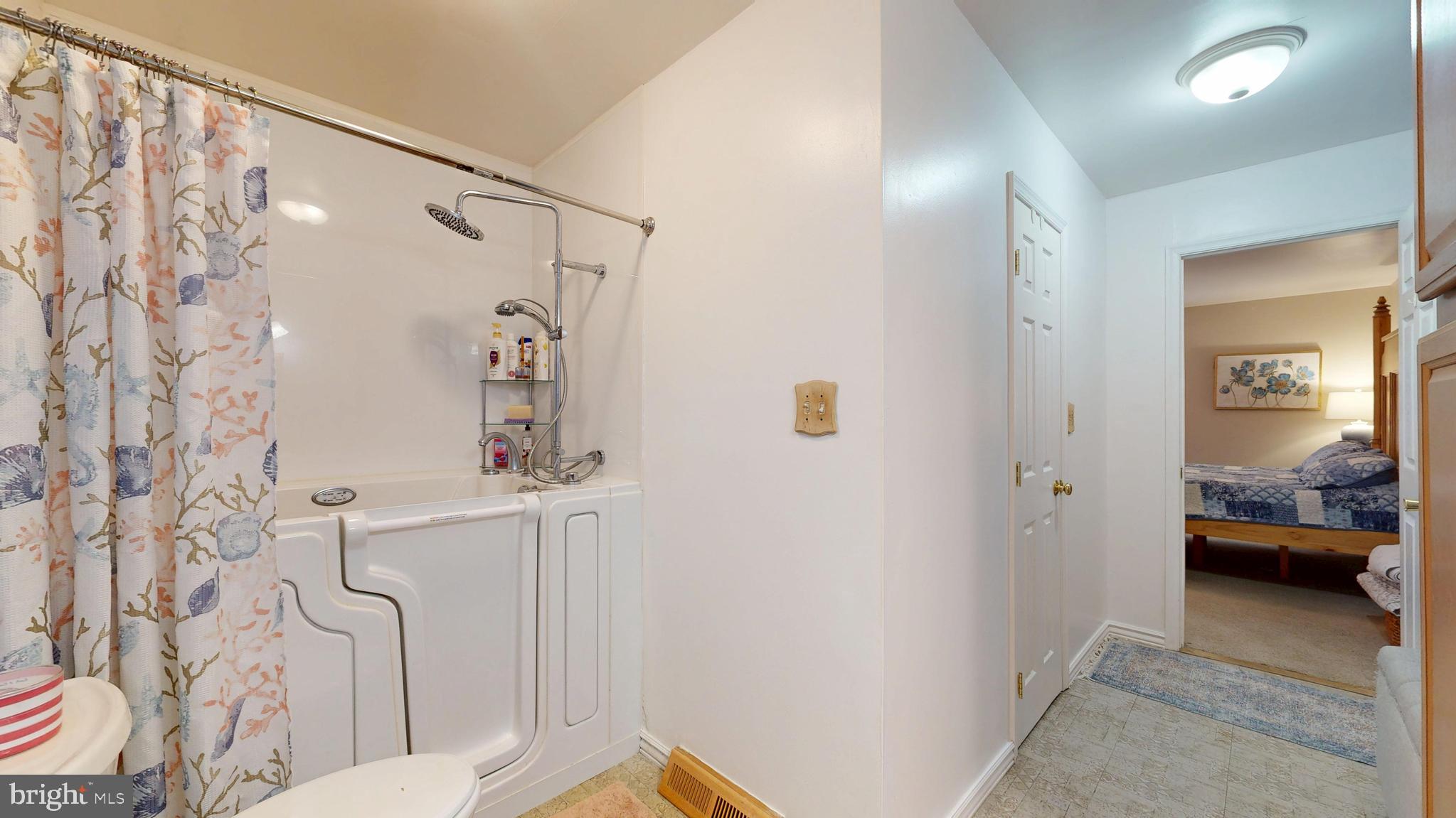 705 Deer Track Lane Dover, DE 19904 - Photo 27 of 29 a bathroom with a bathtub and shower