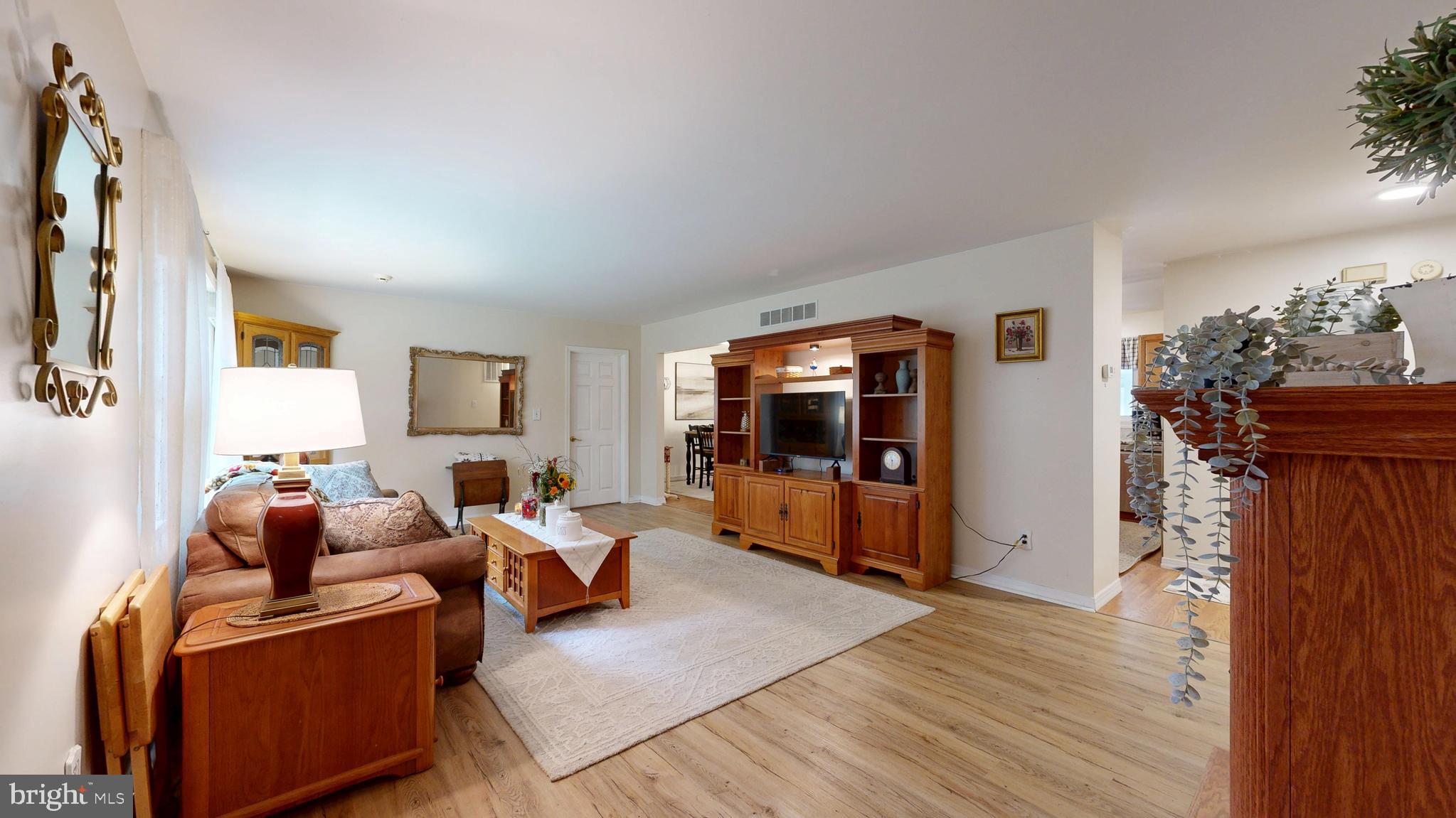 705 Deer Track Lane Dover, DE 19904 - Photo 7 of 29 a living room with furniture and a flat screen tv
