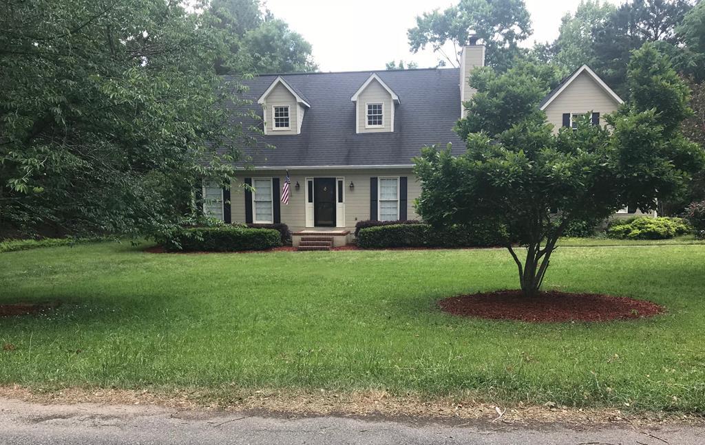 5931 Huddersfield Road Macon, GA 31210 - Photo 1 of 28 a front view of a house with a yard and green space