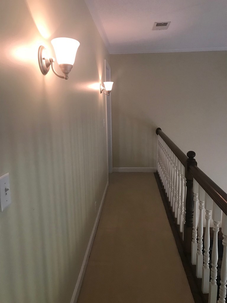 5931 Huddersfield Road Macon, GA 31210 - Photo 17 of 28 a view of a hallway with stairs