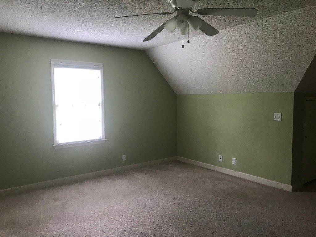 5931 Huddersfield Road Macon, GA 31210 - Photo 18 of 28 an empty room with a window and a fan