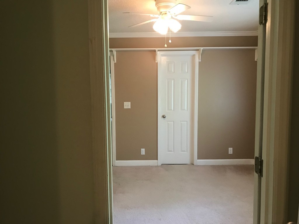 5931 Huddersfield Road Macon, GA 31210 - Photo 21 of 28 a view of a room with a chandelier fan