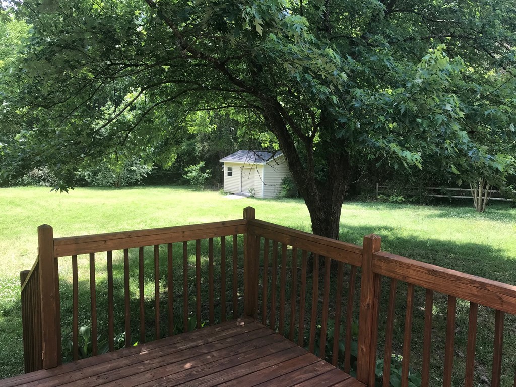 5931 Huddersfield Road Macon, GA 31210 - Photo 27 of 28 a view of a house with backyard and deck