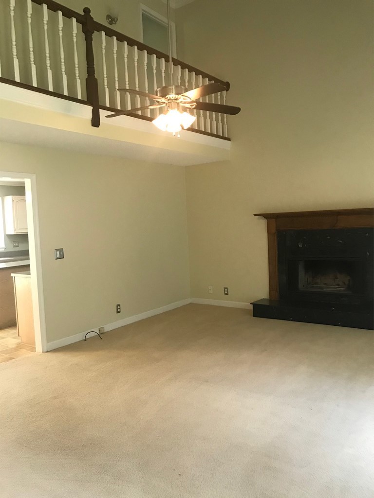 5931 Huddersfield Road Macon, GA 31210 - Photo 5 of 28 a view of empty room with fireplace