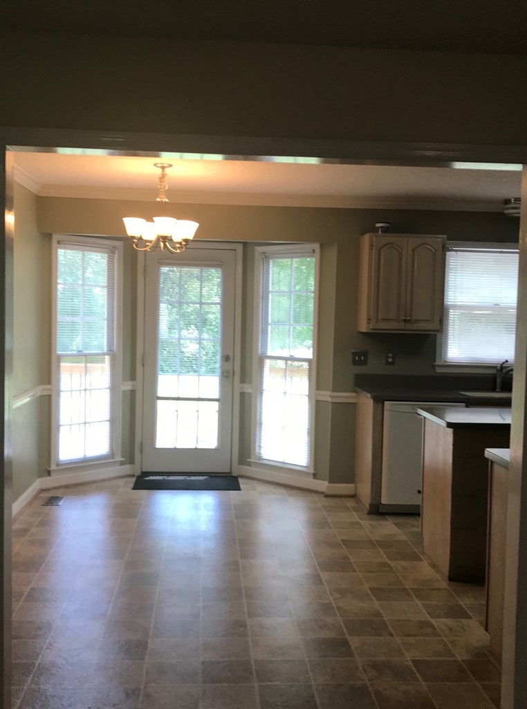 5931 Huddersfield Road Macon, GA 31210 - Photo 9 of 28 a view of a kitchen with a dishwasher and a window