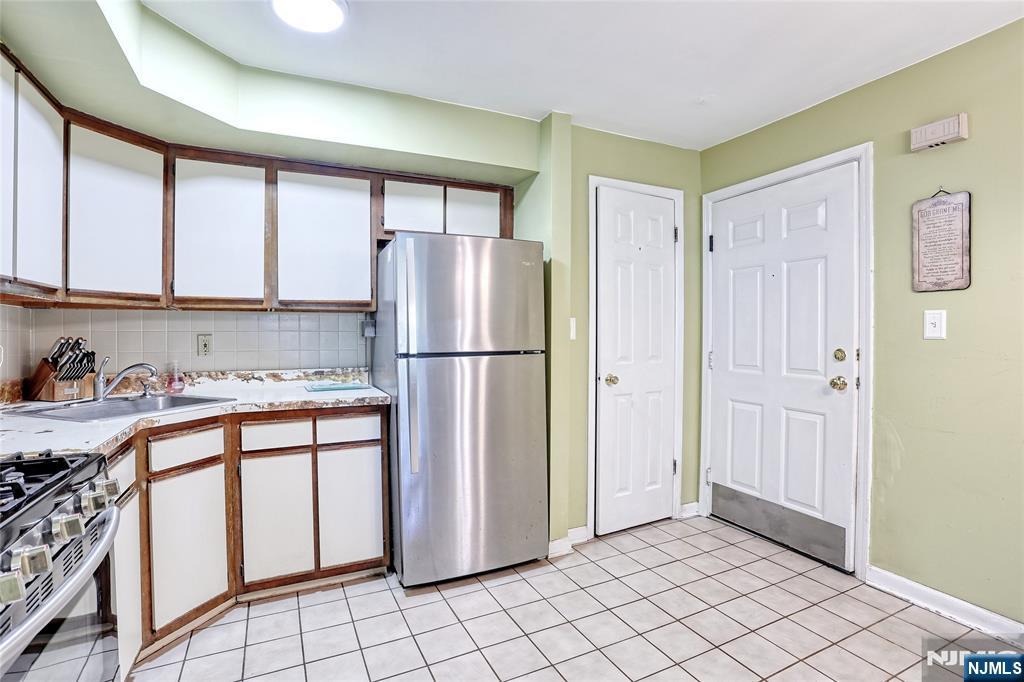 2009 Hawthorne Lane Mahwah, NJ 07430 - Photo 11 of 31 a kitchen with stainless steel appliances granite countertop a refrigerator and a sink