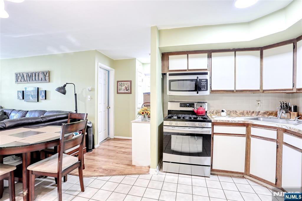 2009 Hawthorne Lane Mahwah, NJ 07430 - Photo 13 of 31 a kitchen with granite countertop a stove and a sink