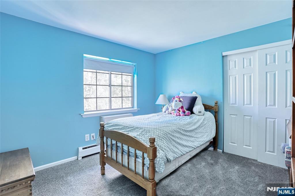 2009 Hawthorne Lane Mahwah, NJ 07430 - Photo 19 of 31 a bedroom with a bed and window